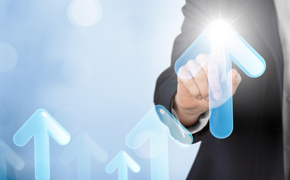 Growth arrow being touched by business hand